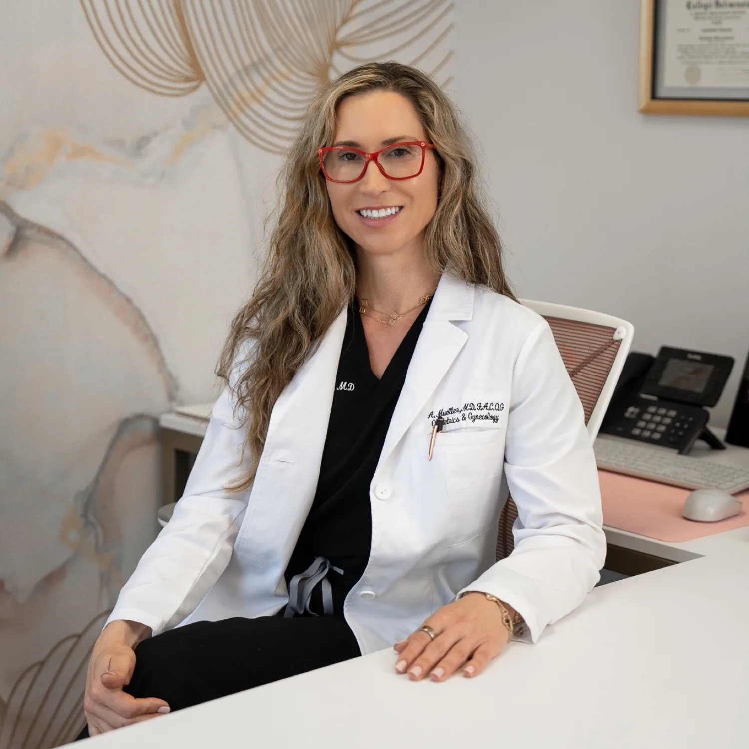 Antoaneta Mueller, MD, FACOG at her desk in Torrance